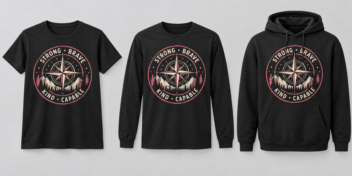 Strong Brave Kind Capable pink and cream compass badge on black T-shirt, long sleeve and hoodie